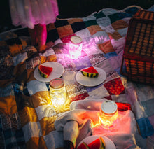 Load image into Gallery viewer, Alex light up yellow glo pal sensory cubes in mason jar used for lantern at nightime picnic. 